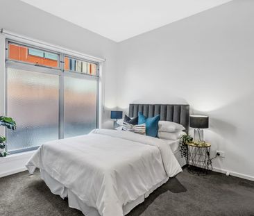 Spacious Two-Bedroom Design with Private Bathrooms - Photo 6