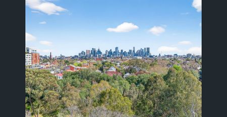 Contemporary Three-Bedroom with Entertainer’s Balcony and Stunning Outlooks - Photo 4