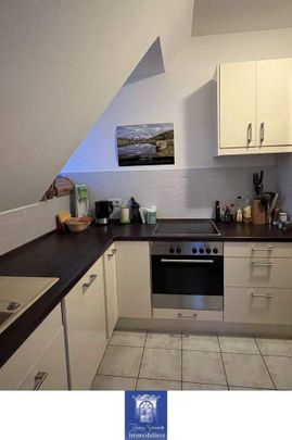 Charmante Dachgeschosswohnung in stilvoller Stadtvilla - Foto 1