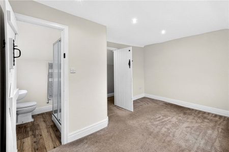 A detached farmhouse with a connected annexe, outbuildings (including stables) and three paddocks in Hanch. - Photo 3