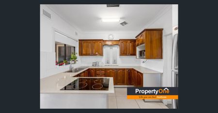 This well maintained 4 Bedroom home offers comfort, convenience, and space for the whole family - Photo 4