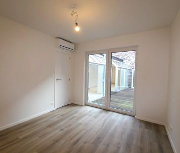 GELIJKVLOERS APPARTEMENT IN HET CENTRUM - Photo 1