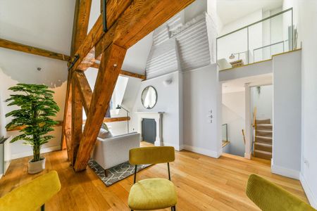 Exceptional duplex apartment within the iconic St Pancras Chambers, offering dramatic ceiling heights, historic character and access to five-star resident services. - Photo 3