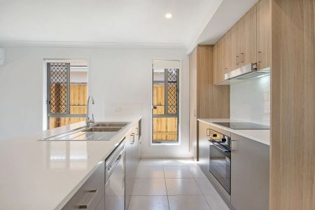 A modern sanctuary in a peaceful, family-friendly pocket, this beautifully finished 4-bedroom home delivers effortless living with a touch of luxury. - Photo 5