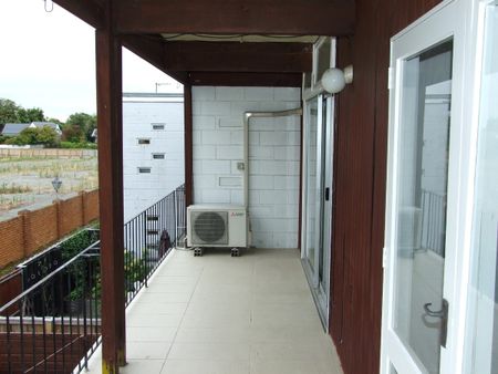 Sunny 2-Bedroom Upstairs Unit with Modern Amenities and Garage! - Photo 5