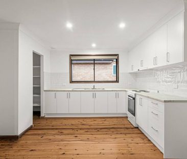 Spacious 4-Bedroom Home in Prime West Wollongong Location - Photo 1