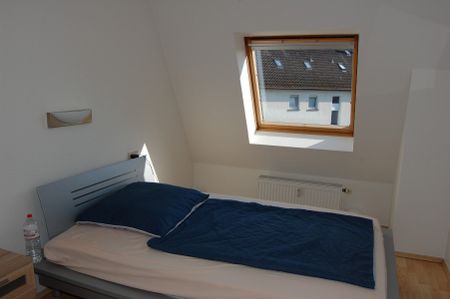 Moderne und helle 2-Zimmerwohnung mit Dachterrasse in schöner Wohnlage! - Foto 3