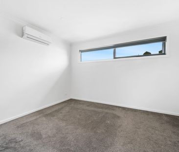 Stylish, Spacious Living with Modern Comfort Across Two Levels - Photo 2