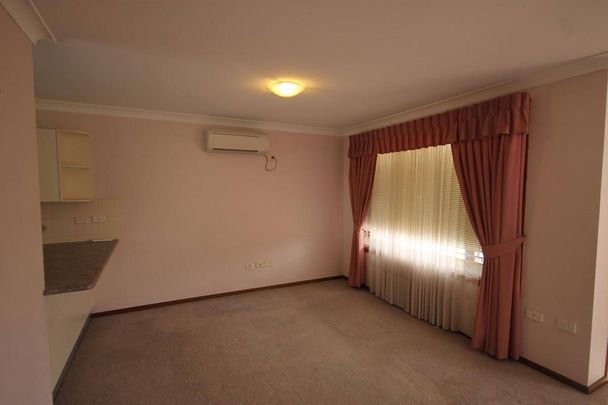 AIR CONDITIONED UNIT IN THE HEART OF TOWN - Photo 1