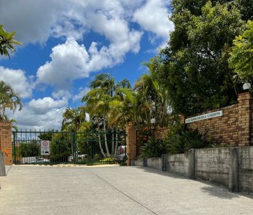 NEAT TOWNHOUSE WITH POOL IN COMPLEX - Photo 1