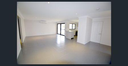 Spacious Family Home with Multiple Living Areas & Modern Comforts - Photo 2