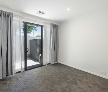 Stylish Three-Level Townhouse with Contemporary Comfort - Photo 1