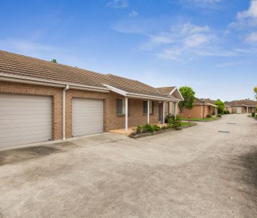 Nestled in a peaceful complex, this delightful two-bedroom unit off... - Photo 2