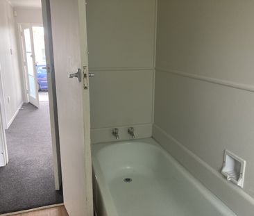 This generous two-bedroom unit offers an open-plan living area, two... - Photo 2