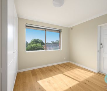 TOP FLOOR LIVING WITH WRAP-AROUND BALCONY - Photo 1