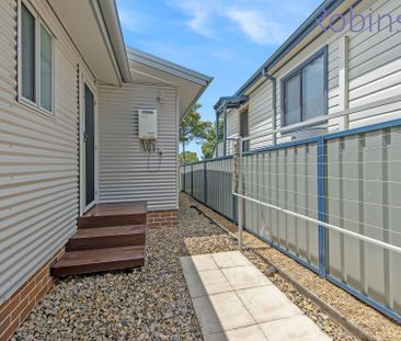 Three bedroom, two bathroom townhouse with double auto-door garage - Photo 1