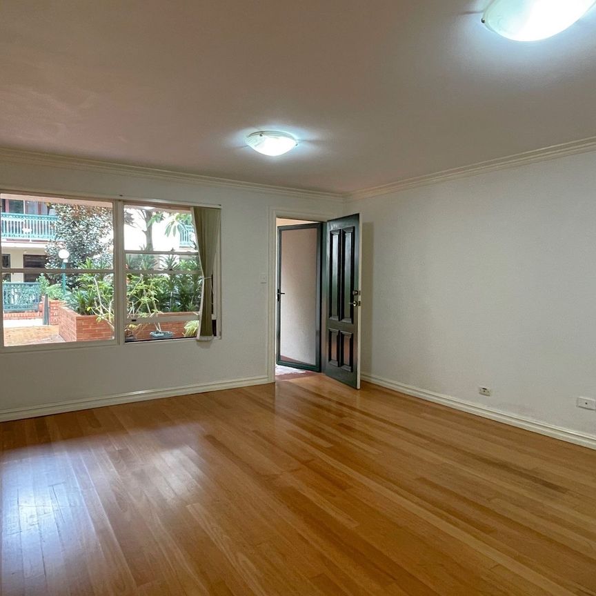 Tranquil sanctuary with lock up garage, convenient hassle-free urban living - Photo 1