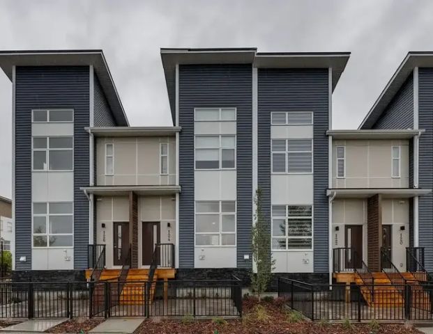 Brand New Upgraded 3 Bedroom Townhome with Double Garage Across Green Space | 124 Walden Lane Southeast, Calgary - Photo 1