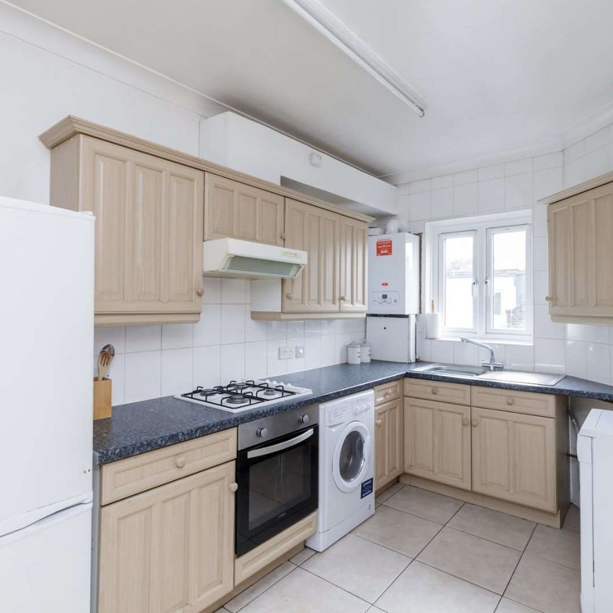 Attractive period conversion property with charm and character located on a popular, tree-lined street. - Photo 1