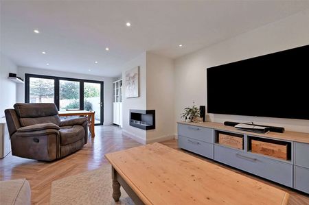 This versatile bungalow includes three bedrooms, principal with dressing room and ensuite, a stunning open plan kitchen with bi-fold doors, and a garden with a heated studio and WC. - Photo 3