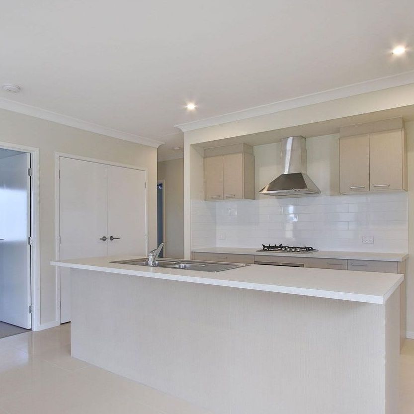 Spacious Modern Home with Ducted AC & Garden Shed - Photo 1