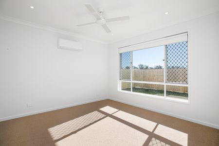 Spacious 4-Bedroom Home in the Heart of Redbank Plains! - Photo 3