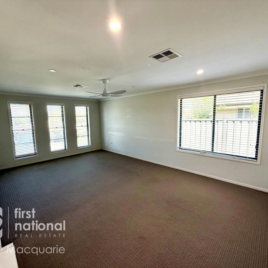 Modern 4-Bedroom Home with Multiple Living Areas - Photo 1