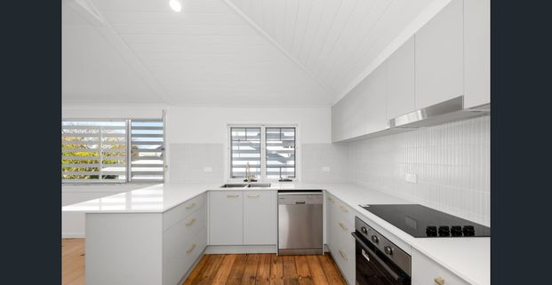 FRESHLY RENOVATED CHARACTER HOME WITH CITY VIEWS - Photo 1