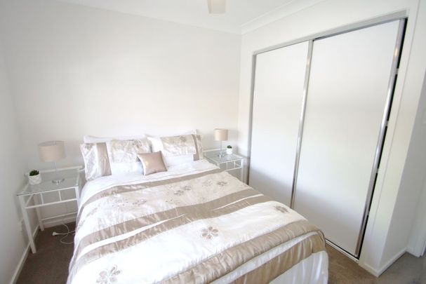 RENOVATED AND FULLY FURNISHED SPACIOUS TOWNHOUSE WITH VIEWS IN THE PACIFIC PARKSIDE COMPLEX!! - Photo 1