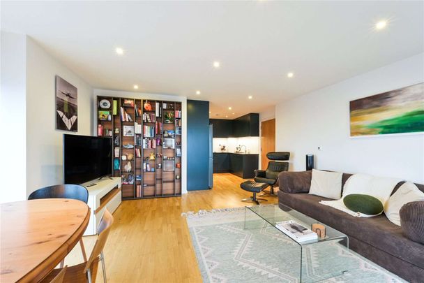 This luxurious 2-bedroom, 2-bathroom 1046sqft apartment on the higher floors of Ability Place, E14, offers contemporary living in one of London's most desirable locations. - Photo 1