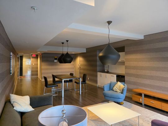 Stylish One Bedroom + Den Residence with Private Balcony - Photo 1