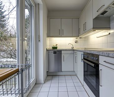 Elegant 2-room apartment with south-facing terrace - Photo 2