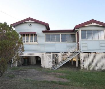 A SPACIOUS HIGH-SET HOME WITH 2 BEDROOMS PLUS ENCLOSED VERANDAS. - Photo 4