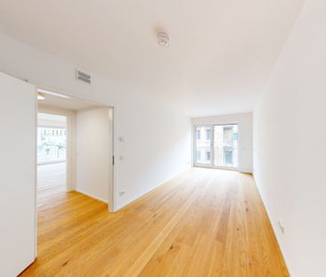 Neubaukomfort: Stilvolle 1-Zimmer-Wohnung mit Einbauküche und Balkon - Foto 1