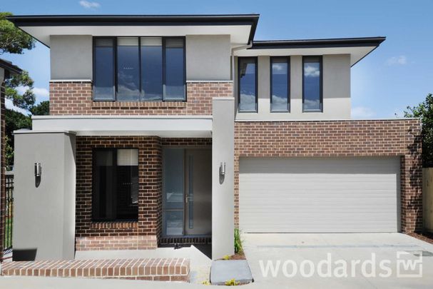 IMPRESSIVE TOWNHOUSE IN MOUNT WAVERLEY SCHOOL ZONE - Photo 1