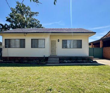MODERN FAMILY HOME WITH MULTIPLE LIVING SPACES! - Photo 1