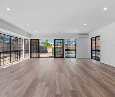 STYLISH LOW MAINTENANCE FAMILY HOME WITH POOL! - Photo 1