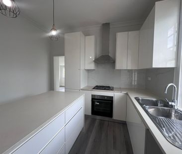 Spacious 3-Bedroom Home with Sunroom and Garden Shed - Photo 6