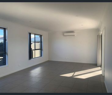 Modern 4-Bedroom Family Home – Lawn Maintenance Included - Photo 2