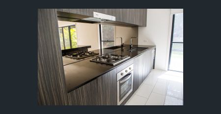 NEW CARPERT -Stylish townhouse that offers you the Gold Coast Living. Bordering the Glades Golf course, - Photo 2