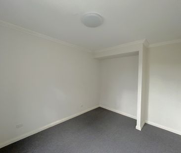 Brand new carpet, three bright rooms with windows, and two parking ... - Photo 6