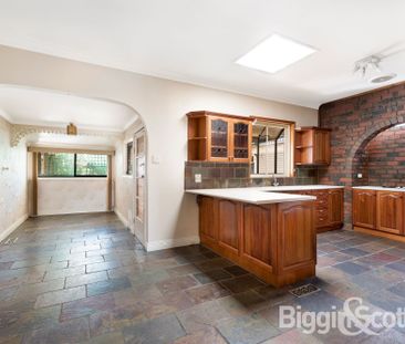 Character filled residence with original features set in a sought a... - Photo 1