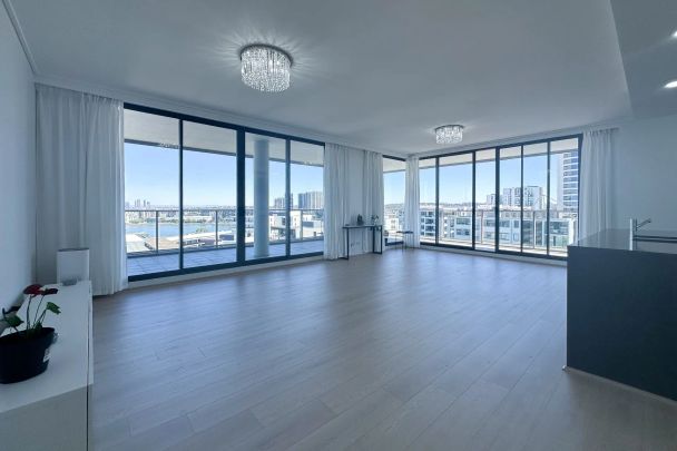 Luxury Apartment with Spectacular Water Views | Top Floor of Complex - Photo 1