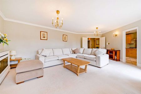 A first floor three bedroom apartment with large wrap around terrace and river views in a secure development with underground parking. - Photo 4