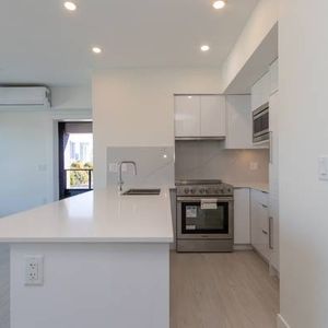 "Brand New Spacious 2/Bed 2 Bath Condo By SkyTrain" - Photo 2