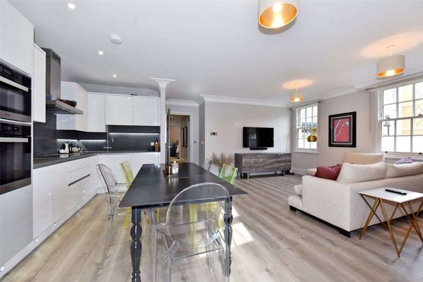 SHORT LET - A beautifully presented two bedroom apartment in a much sought after development with underground parking on the banks of the river Thames. - Photo 1