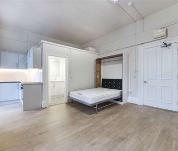 A self contained studio is on the ground floor of a white stucco fr... - Photo 5