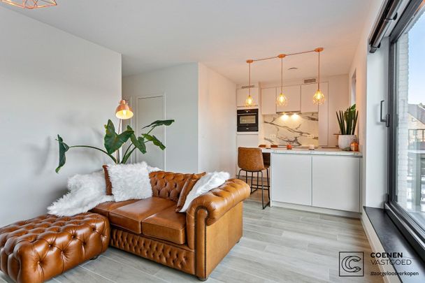 Nieuwbouwappartement te huur met een bew. opp. van 60m², 2 slaapkamers en een ruim terras van 21m² op een toplocatie te 's Gravenwezel! - Foto 1