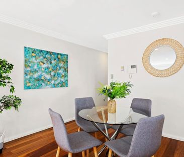 Light Filled Apartment with Oversized Lockup Garage - Photo 3