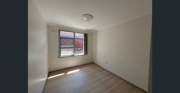 Solid Brick Home with Sunlit Interiors in a Convenient Location - Photo 1